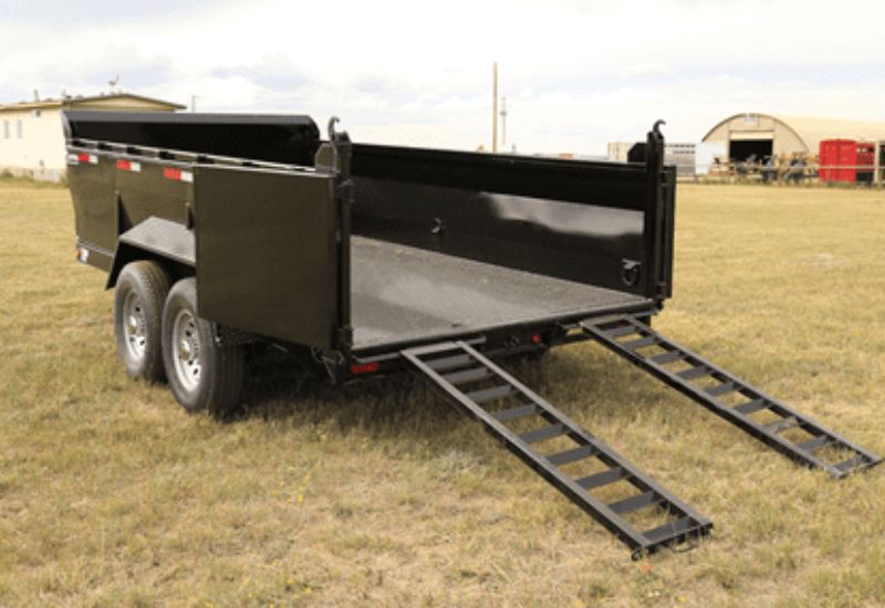 A large utility and dump Oasis Trailer with ramp.