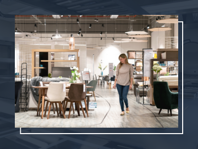 Image shows someone shopping in a furniture showroom to demonstrate considerations for furniture and fixture manufacturers