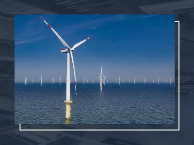 Image shows a wind farm to demonstrate sustainability considerations for furniture and fixture manufacturers